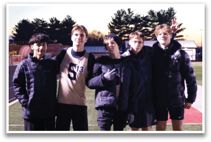 Four young men pose for a photo on a field. Contenido generado con IA