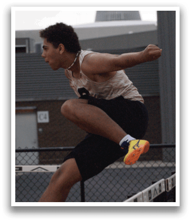 A man is jumping over a barrier, possibly in a competition. Contenido generado con IA