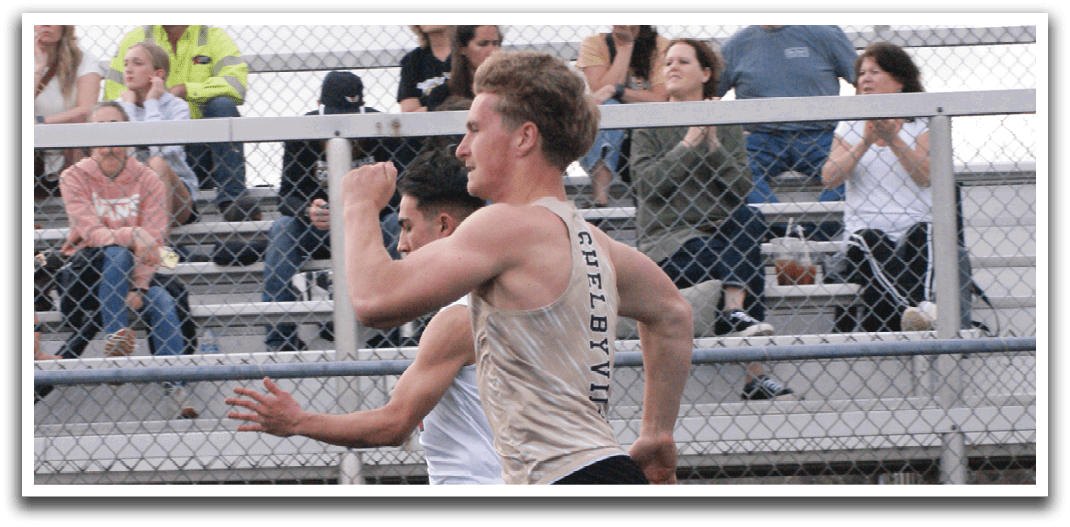 A man is running on a track while a crowd watches. Contenido generado con IA