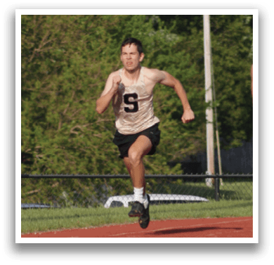 A group of runners are running on a track. Contenido generado con IA