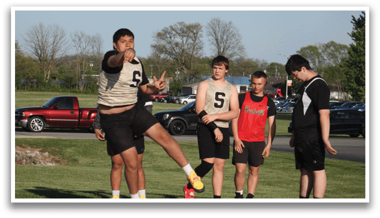 A man is jumping in the air while wearing a jersey with the number 6 on it. Contenido generado con IA