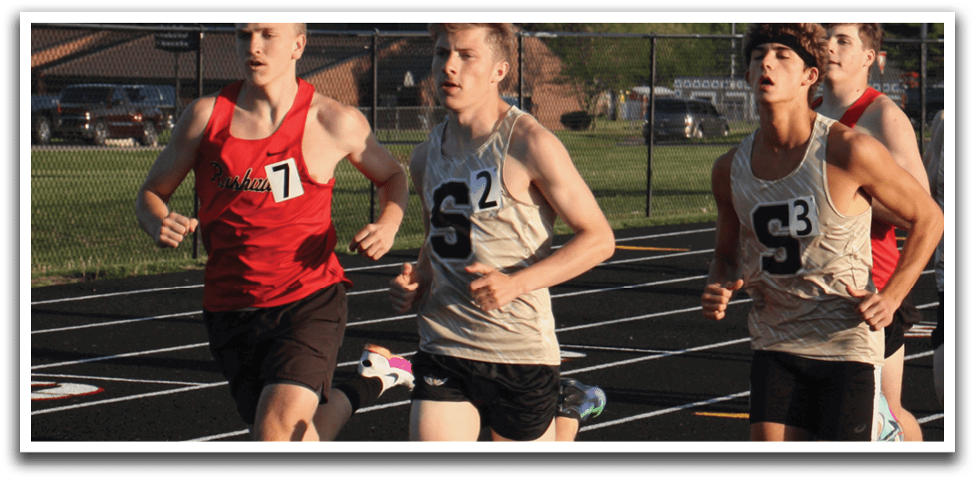 A group of young men are running on a track, wearing uniforms and racing against each other. Contenido generado con IA