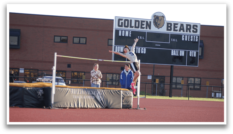 A man is jumping over a bar on a track field. Contenido generado con IA
