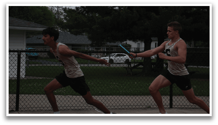 Two men are running on a track, one holding a blue object in his hand. Contenido generado con IA