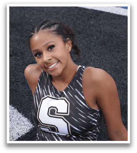 A woman wearing a grey and white uniform is smiling for the camera. Contenido generado con IA