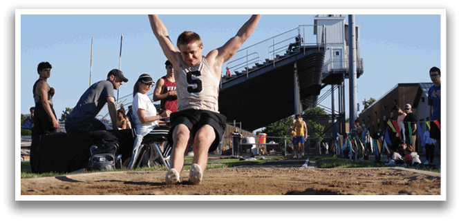 A man is jumping in the air with his arms raised, possibly celebrating or participating in a sports event. Contenido generado con IA