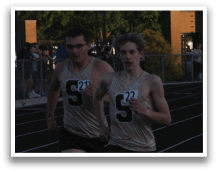 Two men are running on a track, one wearing the number 5. Contenido generado con IA