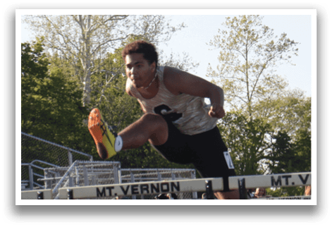 A man is jumping over a barrier in a track meet. Contenido generado con IA