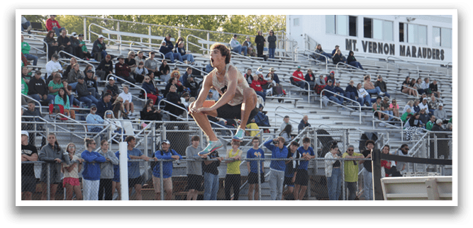 A man is jumping in the air on a track, performing a high jump. Contenido generado con IA