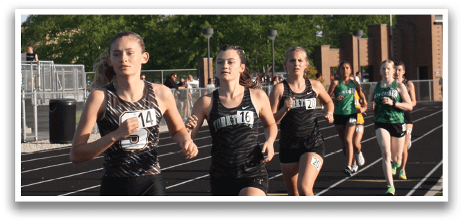 A group of girls running on a track, with one girl in the lead. Contenido generado con IA