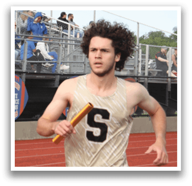 A man is running on a track while holding a baton. Contenido generado con IA