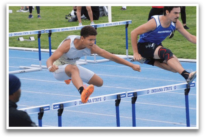 Two men are jumping over a blue barrier. Contenido generado con IA