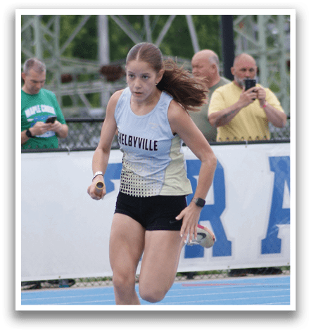 A man in a blue and white uniform is running on a track. Contenido generado con IA