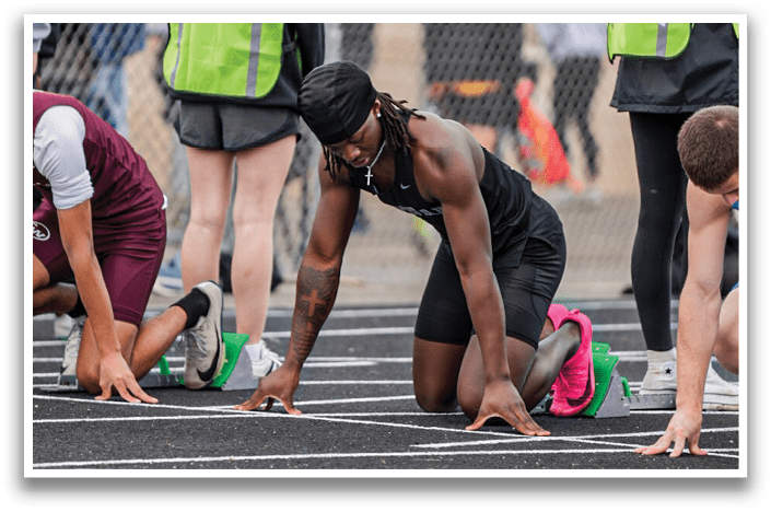 A group of people are on a track. Description generated by AI