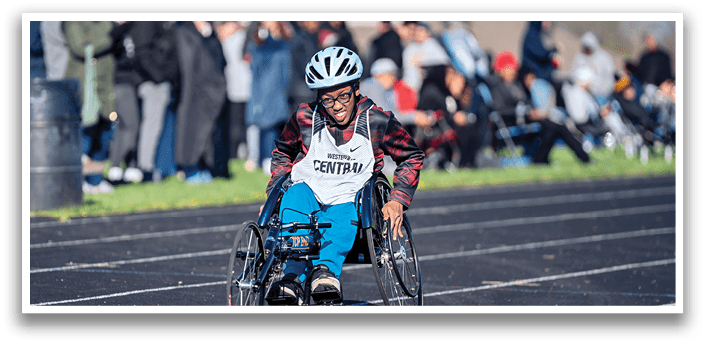 A man in a wheelchair is racing. Description generated by AI