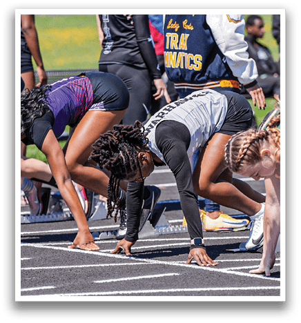A group of people are running on a track. Description generated by AI