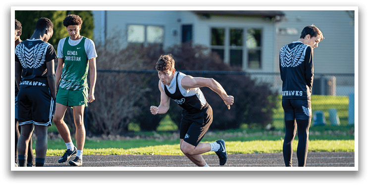 A man running on a track. Description generated by AI