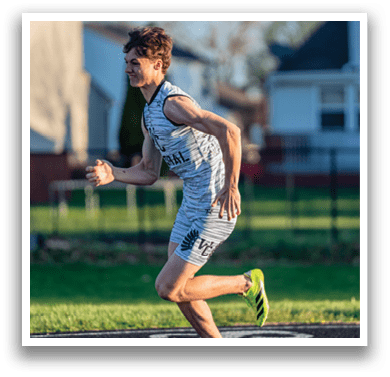 A man running in a field. Description generated by AI