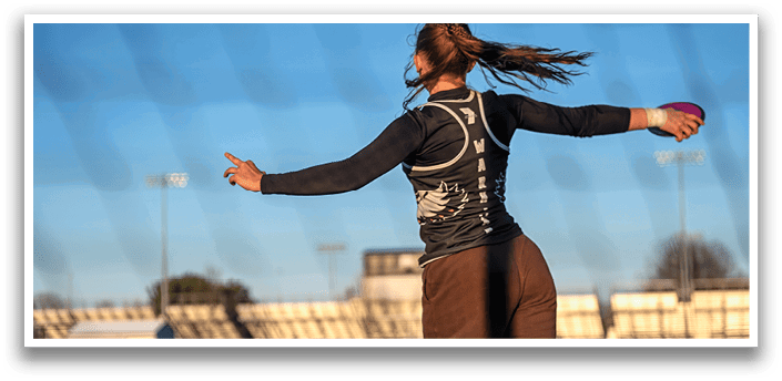 A woman is throwing a frisbee. Description generated by AI