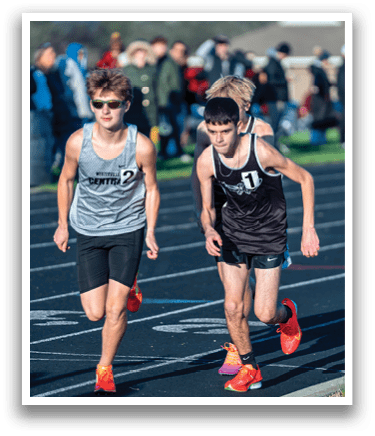 Two runners on a track. Description generated by AI