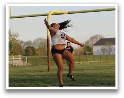 A woman is jumping in the air to catch a frisbee. Description generated by AI