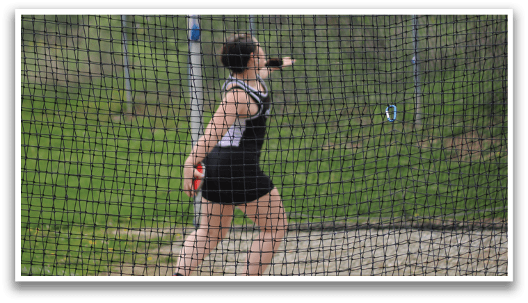 A woman running in a field. Description generated by AI