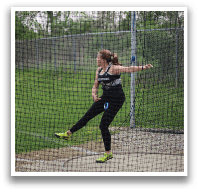 A woman is throwing a frisbee. Description generated by AI