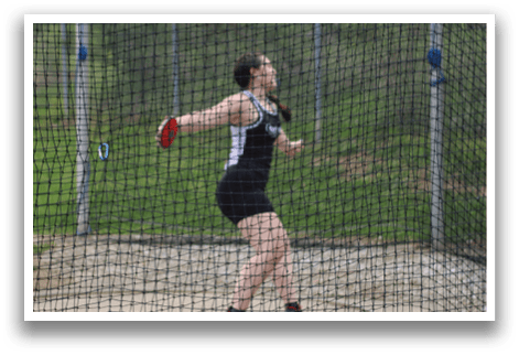 A group of young men running on a track. Description generated by AI