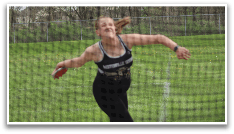 A woman wearing a black shirt and black pants is jumping in the air. Description generated by AI