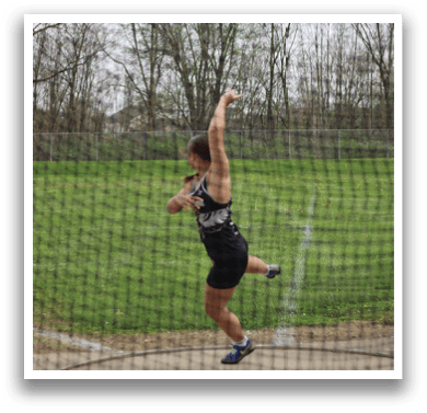 A man is throwing a frisbee in a field. Description generated by AI