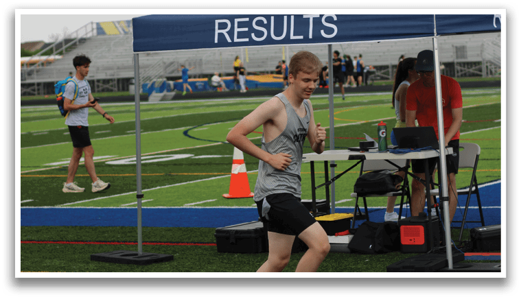 A man is running on a track. Description generated by AI