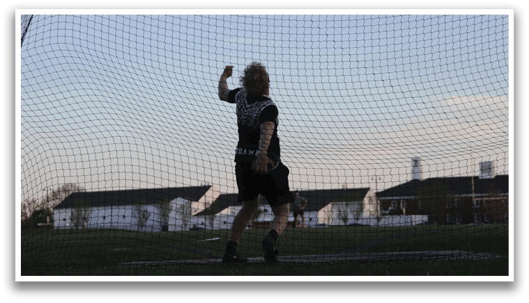 A person is running in a field. Description generated by AI