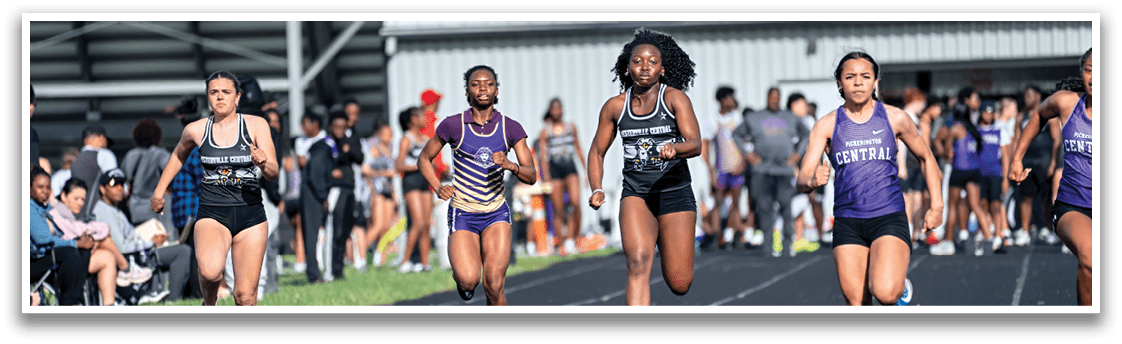 A group of girls running on a track. Description generated by AI
