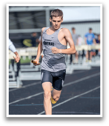 A man running on a track. Description generated by AI