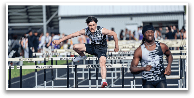 A man is jumping over a hurdle. Description generated by AI