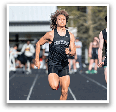 A group of runners on a track. Description generated by AI