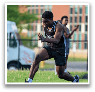 A man running in a field. Description generated by AI