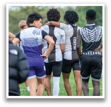A group of people wearing black and white uniforms. Description generated by AI