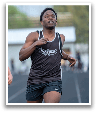 Two men running on a track. Description generated by AI