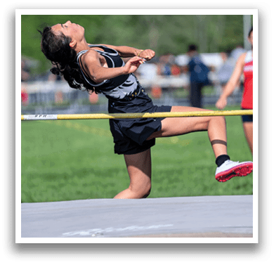 A woman is jumping in the air. Description generated by AI