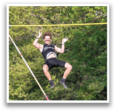 A man is jumping in the air on a trampoline. Description generated by AI