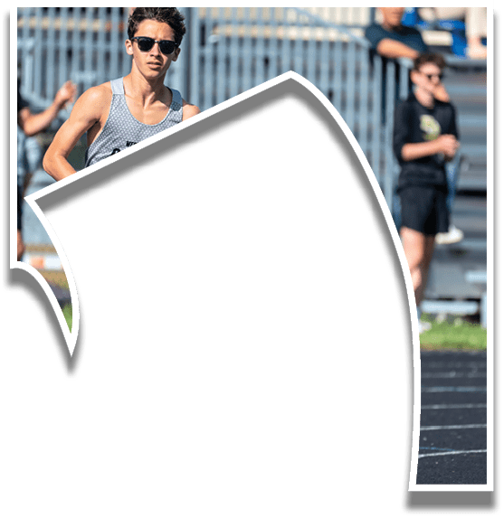 A man running on a track. Description generated by AI