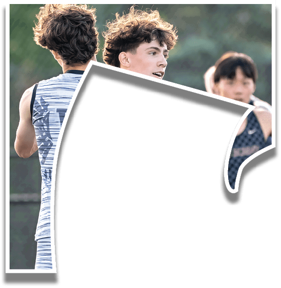 Two men hugging each other on a field. Description generated by AI