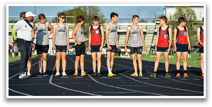 A group of young men wearing shorts and sneakers. Description generated by AI