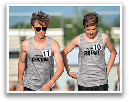 Two men wearing grey shirts and black shorts are walking on a track. Description generated by AI
