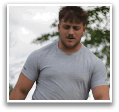 A man wearing a grey shirt. Description generated by AI