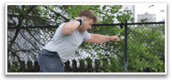 A man is skateboarding in a fenced area. Description generated by AI