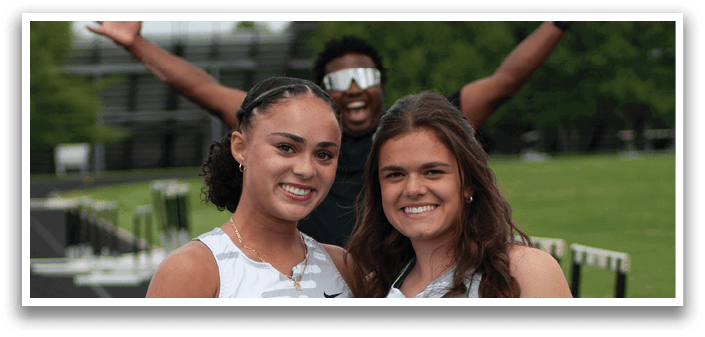 Two girls wearing black and white shirts. Description generated by AI