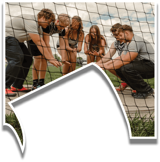 A group of people are posing for a picture. Description generated by AI