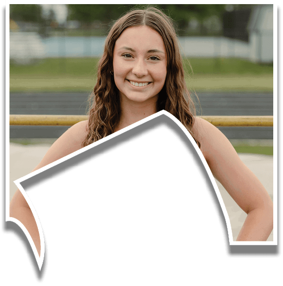 A woman wearing a black and white tank top with the word Warhawks on it. Description generated by AI
